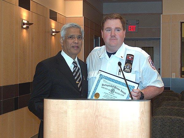 Legislator Pradhan recognizing JJ Weber for his service on the Nanuet Ambulance Corp